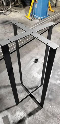 a metal structure sitting on top of a cement floor