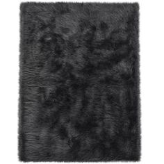 a black rug on a white background with an animal fur pattern in the center and bottom