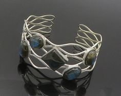 "925 Sterling Silver - Vintage Cabochon Labradorite Wavy Cuff Bracelet - BT7579  925 Sterling Silver - Vintage Cabochon Labradorite Wavy Cuff Bracelet - BT7579  Jewelry Type:         Bracelet   Metal Type:            925 Silver   Metal Size:             7.25\" Length  1\" Height   Stone Type:            Labradorite   Condition:              N/A  Jewelry Weight:     33.4 Grams  PLEASE NOTE: THIS ITEM IS PRE-OWNED. ALTHOUGH MOST ITEMS ARE IN VERY GOOD CONDITION, SOME MAY NEED CLEANING AND/OR MINOR Contemporary Handmade Bangle Jewelry, Contemporary Handmade Jewelry Bracelet, Bracelet Metal, Labradorite Bracelet, Diy Wire Jewelry, Bracelet Cuff, Metal Bracelets, Wire Jewelry, Cuff Bracelet