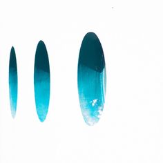 three blue surfboards sitting on top of each other