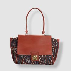 $2080 ETRO Women's Brown Crown Me Paisley Canvas Leather Shoulder Purse Bag Description Etro Crown Me Paisley-Print Canvas Shoulder Bag Etro shoulder bag in paisley printed canvas and calf leather Detachable embellished hardware top handle Flat shoulder strap Flap top with magnetic closure Interior, one zip pocket Approx. 11.4"H x 13"W x 5.9"D Made in Italy. Dust bag included. About Us We sell only 100% authentic clothing from new with tags to gently used. We have a 100% authentic or money back Everyday Use Bags With Paisley Print, Designer Items, Printed Canvas, Canvas Shoulder Bag, Purse Bag, Shoulder Purse, Sell Items, Canvas Leather, Magnetic Closure