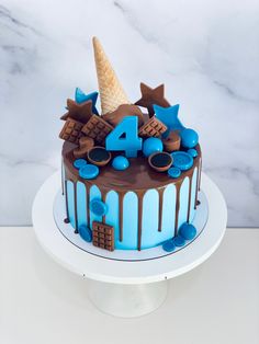 a birthday cake with chocolate icing and ice cream on top, decorated with stars