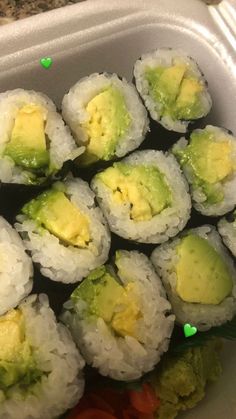 sushi in a plastic container on a table