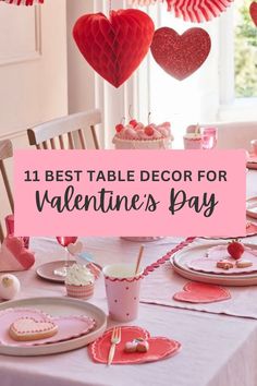 valentine's day table with hearts hanging from the ceiling