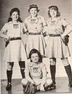 four women in uniforms posing for a photo