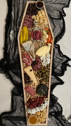 a wooden tray filled with different types of food