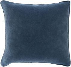 a dark blue pillow on a white background