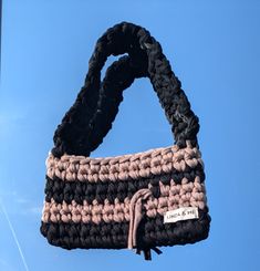 Beautiful black and beige crochet handbag perfect for everyday 🤎🖤 The colours look amazing with every outfit. Material: recycled t-shirt yarn  Measures: approx. 25 x 18 cm Due to the fabric, sizes may vary a little bit. Also, not all colours are always available, since t-shirt yarn is dependent on the recycling process. Handmade Black Cotton Shoulder Bag, Trendy Black Crochet Bag For Everyday Use, Eco-friendly Black Crochet Bag, Handmade Black Crochet Casual Bag, Eco-friendly Black Crochet Tote Bag, Eco-friendly Handmade Black Crochet Bag, Black Crochet Trendy Bag, Casual Black Crochet Bag, Beige Crochet