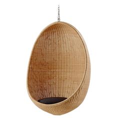 the hanging egg chair is made out of wood and has a black cushion on it