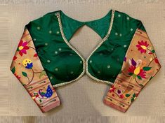 Buy bottle green and golden Paithani saree blouse online in USA. Elevate your saree style with exquisite readymade sari blouses, embroidered saree blouses, Banarasi sari blouse, designer saree blouse, choli-cut blouses, corset blouses from Pure Elegance Indian fashion store in USA.-full view Banarasi Blouse Designs Latest Back, Bottle Green Saree Blouse Designs, Green Blouse Piece With Cutdana For Transitional Season, Transitional Green Blouse Piece With Cutdana, Designer Wear Transitional Green Blouse Piece, Transitional Season Green Choli With Cutdana, Green Long Sleeve Choli With Cutdana Details, Green Traditional Wear With Zari Weaving For Celebration, Green Choli With Zari Work For Transitional Season