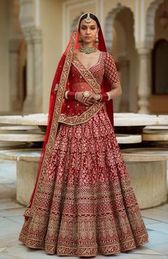 a woman in a red bridal gown