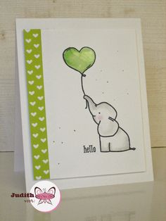 a card with an elephant holding a green balloon