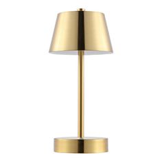 a gold table lamp on a white background