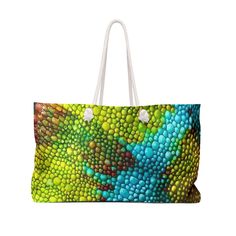 a green and blue lizard skin pattern on a white background weekend duffel bag with handles