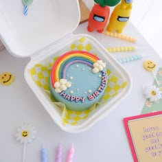 a birthday cake sitting on top of a table next to other decorations and decorating items