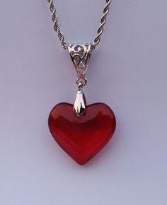 Small Red Glass Heart Silver Charm Necklace  ❤ Sweet Red Glass Heart measures      25mm X 20mm and uses an      ornate filagree silver bail. Strung on a silver-plated stainless steel ROPE CHAIN with lobster clasp of custom length: CHOOSE YOUR CHAIN LENGTH FROM OUR PULL-DOWN MENU: ❤ 45cm /17.7 inches OR ❤  50cm / 19.7 inches OR ❤ 55cm / 21.6 inches OR ❤ 60cm / 23.6 inches SPEEDY SHIPPING: ❤ Ships same day as ordered to USA. ❤ NO RETURNS ACCEPTED ON THIS ITEM. Live the HEARTFELT Life! Red Heart Charm Necklace For Gift, Red Heart Necklace For Gift, Red Heart Necklace For Gifts, Red Heart Necklace For Valentine's Day Gift, Red Sterling Silver Heart Bead Necklace, Red Sterling Silver Heart Necklace With Beads, Red Heart Cut Necklace For Mother's Day, Valentine's Day Red Heart Necklace, Red Heart Pendant Necklace In Sterling Silver