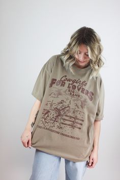 Cowgirls Are For Lovers Oversized T-Shirt. Show off your southwestern style with our Cowgirls Are For Lovers Oversized T-Shirt! Featuring a western-inspired design with a cowgirl and horse, this brown tee is perfect for those who love cowgirls. With an oversized fit, this shirt is comfortable and stylish. Get yours now! Model's height is 5'3 and wearing a size s/m. 100% Cotton. Shipping and Refunds: Shipping Policy Refund Policy Brown Tee, Cowgirl And Horse, Southwestern Style, Silver Jeans, Beauty Collection, Oversized T Shirt, For Lovers, Long Sleeve Bodysuit