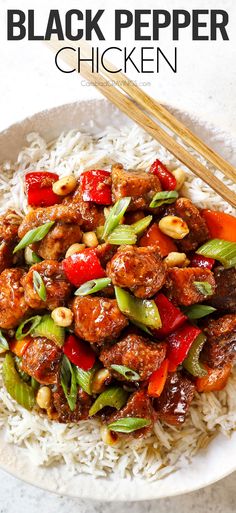 a white plate topped with meat and vegetables next to chopsticks on top of rice