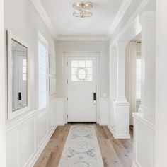 the hallway is clean and ready to be used as a home decorating area for guests