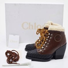 Brand New! Chloe Boots In Brown And Black. Meticulously Designed Into A Smart Silhouette, These Boots Are On-Point With Style. They Come With Comfortable Insoles And Durable Outsoles To Last You Forever. These Boots Are Just Amazing Includes: Original Dustbag, Original Box, Extra Lace Size: It 39 Exterior Material: Leather, Rubber Lining Material: Fur Insole Material: Shearling Fur Sole Material: Rubber Hardware: Silver Tone Closure Type: Lace Up Heel Size: 9.5 Cm / 3,5 Inches Made In Italy Winter Leather Heeled Boots With Rubber Heel Cap, Winter Ankle-high Calf Leather Heeled Boots, Winter Lace-up Boots With Lug Sole And Calf Leather, Winter Calf Leather Lace-up Boots With Lug Sole, Winter Calf Leather Ankle Lace-up Boots, Luxury Brown Heeled Boots For Winter, Luxury Brown Winter Heeled Boots, Winter Ankle Lace-up Boots In Calf Leather, Luxury Winter Boots With Round Toe