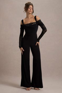 Embrace the lace in Palmira, our alluring jumpsuit. Crafted in a sculpting stretch jersey, this black jumpsuit boasts long lace sleeves, knotted straps and flattering wide legs. For the perfect graduation ensemble, style yours with some court shoes like Blade.Features - Premium stretch jersey - Bodycon fit - Square neckline - Knotted straps- Long lace sleeves- Invisible zip closure - Wide legSizing & Fit Model is 5'7 and wears UK size 8 / US size 4 Product Information Designed exclusively by Club L London Double layered with good stretch Premium jersey & lace in Black (95% Polyester, 5% Elastane) 84cm total leg length SKU: CL135101002 Long Lace Sleeves, Black Dress Prom, Black Tie Gala, Party Dress Long Sleeve, Maxi Dress Prom, Bridesmaid Outfit, Black Sequin Dress, Black Velvet Dress, Invisible Zip