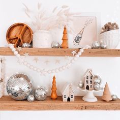 a shelf with christmas decorations on it and other items sitting on top of the shelves