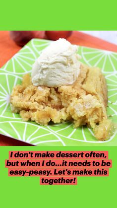 a piece of cake with ice cream on top sits on a green plate next to an apple