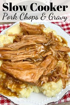 slow cooker pork chops and gravy on top of mashed potatoes