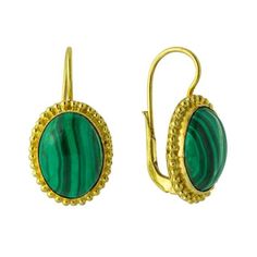 Valued by the Egyptians as talismans, malachite is still a favorite gem today. These stones are set in 24k gold vermeil (gold over sterling silver); European back for pierced ears. Size: 1 Inch. Gold Malachite Jewelry For May Birthstone, Gold Emerald Jewelry With Cabochon, Oval Malachite Jewelry In Yellow Gold, Gold Cabochon Jewelry For May Birthstone, Formal Oval Malachite Jewelry, Elegant Gold Malachite Earrings, Oval Green Brass Jewelry, Oval Gemstone Gold Plated Earrings, Gold Malachite Gemstone Jewelry