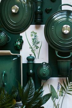 green dishes and utensils are displayed on a wall