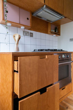 a kitchen with wooden cabinets and an oven