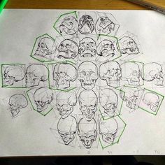 a bunch of skulls drawn on top of a piece of paper