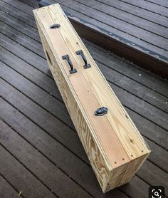 a wooden box sitting on top of a wooden floor