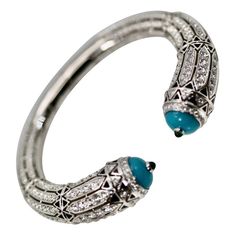 Check out this item from 1stdibs! Cartier High Jewelry Diamond Turquoise Bracelet Deco Inspired 12.73 Carat: https://www.1stdibs.com/id-j_21410722 Luxury Turquoise Bracelets With 17 Jewels, Luxury Silver Cartier Bracelets, Cartier Luxury Gemstone Jewelry, Luxury Cartier Gemstone Jewelry, Elegant Turquoise Bangle For Formal Occasions, Turquoise Bangle Bracelet For Formal Occasions, Formal Turquoise Bangle Bracelet, Luxury Blue Cuff Bracelet, Luxury Turquoise Bangle Bracelets