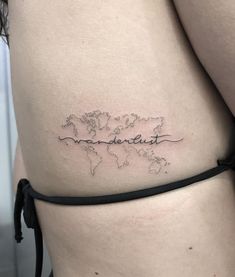 a woman with a tattoo on her stomach that reads, world map and the words wonderful