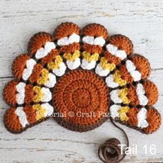 an orange and white crocheted turkey hat