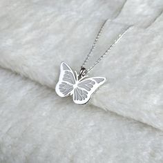 White Charm Necklace For Birthday, White Charms Necklace For Birthday Gift, Handmade White Charm Necklaces For Birthday Gift, Silver Clavicle Chain Necklace For Christmas, Silver Necklace For Christmas Gift For Her, Butterfly Charms Necklace For Gift, Butterfly Necklace As A Gift, White Sterling Silver Butterfly Necklace With Clavicle Chain, Round Butterfly Necklace Gift