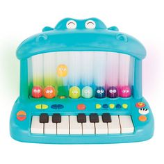 a blue toy piano with many different colored balls on it's keys and eyes