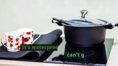 two mugs sitting on top of a stove with the words it's waterproof