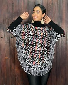 This gorgeous Mexican Artisanal Poncho is perfect for the cold months ahead! The multicolor Fair Isla design adds that perfect pop of color and style to your wardrobe. This poncho is knit, has open sides and it comes in one size so anyone ranging from size Small to 2x will be able to wear it. forrado por dentro, lo que hace ideal para climas muy frios. One Size Acrylic Poncho Shawl, Multicolor Shawl Poncho For Festival, Multicolor Cape Poncho For Fall, Multicolor One-size Festival Poncho, Multicolor Shawl Cape One Size, One Size Multicolor Shawl Cape, One Size Multicolor Poncho For Festival, Multicolor One Size Poncho For Festivals, Black Poncho With Batwing Sleeve