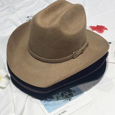 Product Category: Cowboy HatSuitable season: autumnHat style: high topHat brim style: wide brimColor: black, haze gray, dark brown, khaki, white, royal blue, bright red, lake blue, gray, dragon fruit color, burgundy, rose red, dark green, light brown, camel, navy blue, beigeSize: M (57cm), L (59cm)Function: warmth, sunshadeStyle: Versatile, elegant, casual, fashionable OL, simple, European and AmericanStyle Category: Fashion Commuting Casual Beige Felt Hat For Rodeo, Casual Wide Brim Felt Hat For Ranch, Vintage Fedora For Winter Ranch, Casual Beige Hat Bands For Western-themed Events, Casual Beige Hat Band For Western-themed Events, Vintage Winter Fedora For Ranch, Beige Felt Hat For Rodeo In Winter, Beige Felt Hat For Rodeo And Winter, Trendy Fedora Hat Bands For Ranch