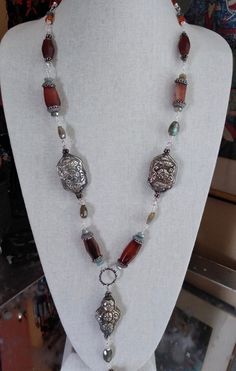 Antique African Trade Carnelian and Tibetan Repousse Assemblage Necklace - Etsy Bohemian Silver Agate Jewelry, Silver Wire-wrapped Necklace With Czech Glass, Silver Wire Wrapped Necklace With Czech Glass, Handmade Artisan Antique Silver Necklace, Bohemian Silver Carnelian Necklaces, Silver Carnelian Bohemian Necklace, Silver Carnelian Bohemian Necklaces, Artisan Agate Necklaces Nickel Free, Artisan Agate Nickel-free Necklaces