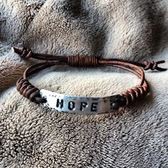 HOPE ID Bracelet silver leather Hand Stamped by DESIGNbyANCE Adjustable Stamped Leather Bracelet, Adjustable Silver Leather Bracelet Hand Stamped, Adjustable Stamped Leather Bracelet For Everyday, Adjustable Stamped Brown Leather Bracelet, Vintage Stamped Leather Bracelet Gift, Id Bracelets, Wedding Bracelet, Silver Bracelets, Mens Bracelet