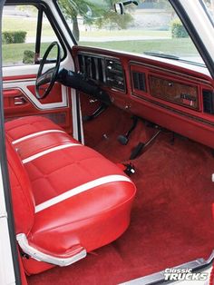 the interior of a red and white truck