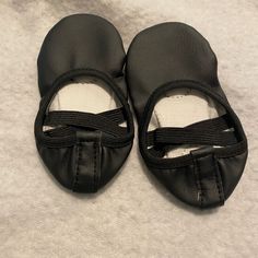 Brand New Black Slip-resistant Slip-on Slippers, Black Slip-on Closed Toe Slippers, Black Synthetic Slippers With Rubber Sole, Black Slip-on Synthetic Slippers, Synthetic Round Toe Dance Shoes For Practice, Black Slip-on Flat Slippers, Low-top Synthetic Dance Shoes With Rubber Sole, Black Non-slip Flat Sneakers, Black Non-slip Flat Slippers