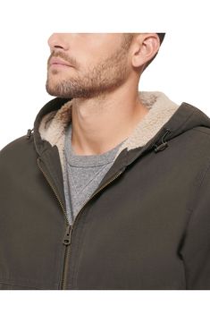 This cotton-canvas bomber jacket is ready for whatever the day brings your way—including chilly weather, thanks to the cozy faux-shearling lining. 28" length (size Medium) Drawcord-toggle hood 100% polyester faux-shearling lining 100% cotton Machine wash, tumble dry Imported Chilly Weather, Hooded Jacket, Cotton Canvas, Levi's, Work Wear, Bomber Jacket, The Day, Nordstrom, Size Medium