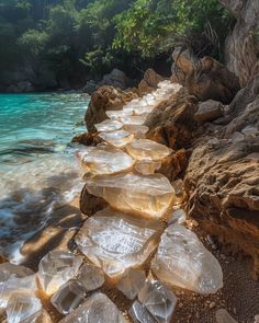 the rocks are lined up along the water's edge to be used as stepping stones