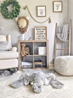 a baby's room with stuffed animals and toys on the floor, including a teddy bear