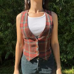 Vintage 1970s Plaid Wool Vest. The Colors Are Amazing, The Fit Is Perfect, Vests Are So In For Fall Right Now. Size Extra Small. Pit To Pit Is 15.5 Inches And Drop Is 19.5 Inches. #Fall #Plaid #Vest #Punk #Vintage Vintage Orange Fall Tops, Vintage Sleeveless Winter Vest, Vintage Winter Vest With Button Closure, Fitted Plaid Sleeveless Vest, Retro V-neck Winter Vest, Vintage Fitted Multicolor Vest, Plaid Vest, Punk Vintage, Fall Plaid