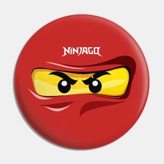 a red button with a yellow face and the word ninja on it's side